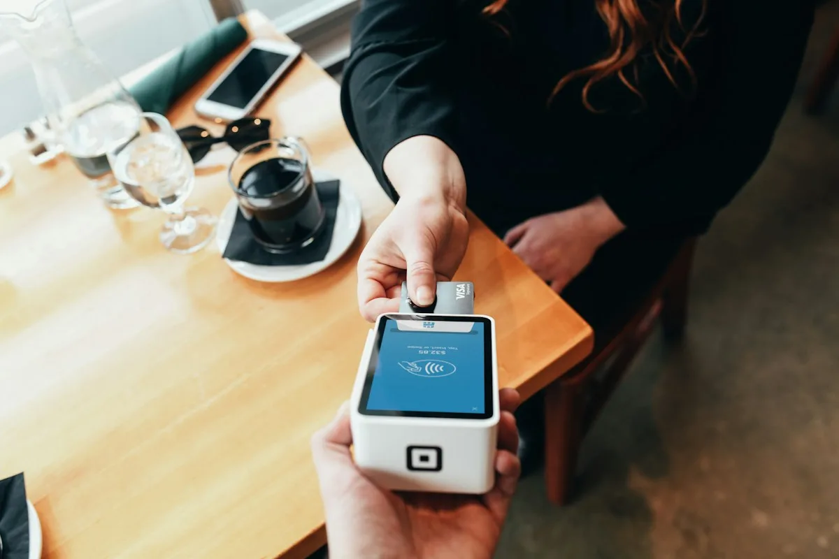 Contactless card payment at a café counter